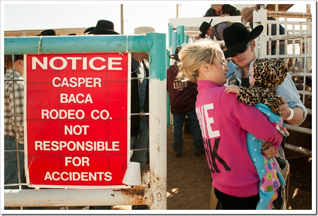 A Professional Bull Rider greets is family before his bull ride at a rodeo in Belen, New Mexico